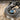 Capricorn Curling Sea Goat Ring, oxidized finish, close-up view of goat and blue topaz