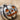 Jack o Lantern Earring, oxidized silver, close-up on sand