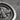 Faravahar Textured Coin Pendant, oxidized silver, close-up of sculpted winged figure