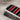 Stripe Bar Signet Ring, oxidized silver, close-up of red and black enamel channels
