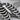 Rib Arcade Drop Earring, oxidized silver, close-up of ribcage relief