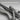 Skeleton Hand Bass Pendant, oxidized silver, close-up of skeletal hand and guitar strings