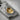 Shibui Low Ember Pendant — 18K Gold Vermeil, close-up of textured surface and flush-set spinel