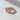 Rose gold plated True Love Waits ring with heart knot and crystal accent on white surface
