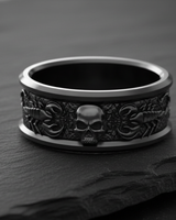 Angled view of the Silver Scorpion Skull Ring, highlighting the 3D relief of the scorpion and skull on a slate rock.