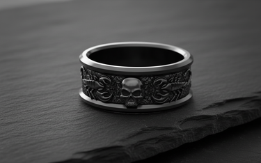 Angled view of the Silver Scorpion Skull Ring, highlighting the 3D relief of the scorpion and skull on a slate rock.