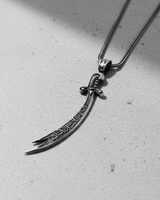 925 sterling silver Zulfiqar sword pendant with Arabic calligraphy displayed on grey background