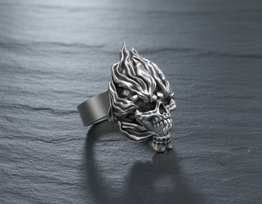 Close-up of gothic flaming skull ring made of oxidized sterling silver with detailed eye sockets