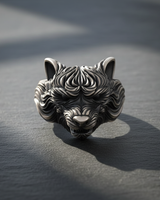 Front view of handcrafted 925 sterling silver wolf ring showing detailed snout and fur texture on dark background