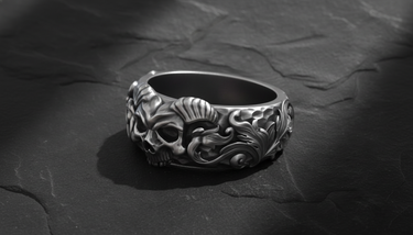 Side profile of silver skull ring showing detailed hammered texture and oxidized floral scrollwork design