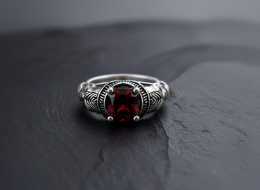 Close up of red gemstone setting and skull details on handcrafted gold vermeil statement ring