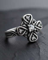 Side view of 925 sterling silver Celtic ring showing oxidized finish and textured band details