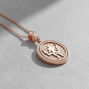 Rose gold plated silver Ophiuchus pendant featuring serpent bearer relief on textured background