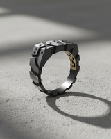 Side profile of handcrafted silver architectural ring showing inner gold lattice detail and thick band