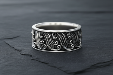 925 sterling silver ocean wave ring featuring intricate Japanese style cresting waves on a dark stone background