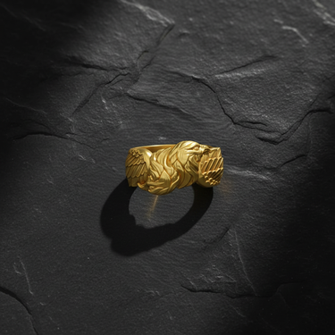 Gold vermeil double headed eagle ring featuring intricate feather details on dark textured background