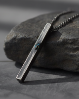 925 sterling silver brutalist bar pendant with rugged texture and blue accent on dark stone