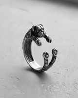 Side profile of handcrafted 925 sterling silver pug ring showing textured fur and wrap design on grey background