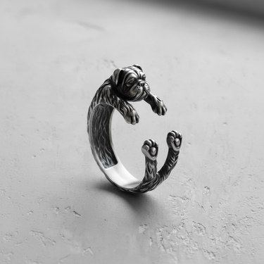 Side profile of handcrafted 925 sterling silver pug ring showing textured fur and wrap design on grey background