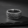 925 sterling silver antique band ring with intricate quatrefoil pattern on dark stone background
