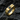 Premium 925 sterling silver based square gemstone signet ring with gold vermeil resting on dark rocky texture
