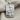 Queen of diamonds pendant, polished silver, front view on fabric