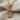 Treble Clef Note Pendant, gold vermeil, product photo on fabric