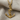 Anchor rope pendant, gold vermeil, product photo on fabric