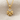 Close-up detail of handcrafted 925 sterling silver heart clover pendant resting on a textured linen fabric