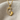 Mother Baby Footprint Pendant, gold vermeil, front view on textured fabric