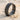 Grooved Band Ring, black rhodium, product view on sand with seashells