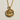 Virgo Zodiac Medallion Pendant, gold vermeil, front view on textured surface