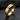 Three-quarter angle view of the engraved Define Yourself band ring resting on dark textured slate background
