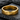 Macro view of the engraved quote ring resting on dark stone showcasing the polished gold surface