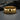 Close-up of premium heritage Stonewall 1969 ring displaying deep typewriter engraved text resting on dark stone