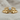 Baby hands birthstone ring, gold vermeil, front view on fabric