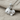 Swimming Goldfish Pendant, polished silver, product view on linen fabric