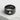 Card club ring, black rhodium plated, product photo on textured surface