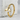 Minimalist whale tail ring crafted from premium 925 silver displayed elegantly on a textured stone block