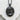 Baby girl pendant, black rhodium plated finish, front view on stone