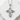 Close-up of premium sterling silver cross pendant resting on a textured white stone highlighting the elegant design