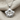 Layered Lotus Pendant, polished, front view on fabric
