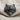Wolf Pelt Skull Ring, black rhodium plated, front view on fabric
