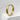 Hammered Enso Ring, gold vermeil, standing on white stone ledge