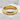 Close-up of crafted bamboo stalk ring resting on textured concrete block highlighting its smooth nodes