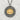 Close-up of sterling silver lotus blossom pendant on a textured surface highlighting the detailed gold vermeil petals