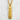 Close-up of golden samurai kanji pendant hanging on box chain against textured white stucco background.