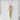 Close-up of elegant two-tone chopstick pendant with engraved silver disc resting on a textured white stone block