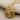 Spiral Conch Pendant, gold vermeil, angled view on fabric
