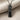 Swim Mantra Pendant, black rhodium, angled view on fabric